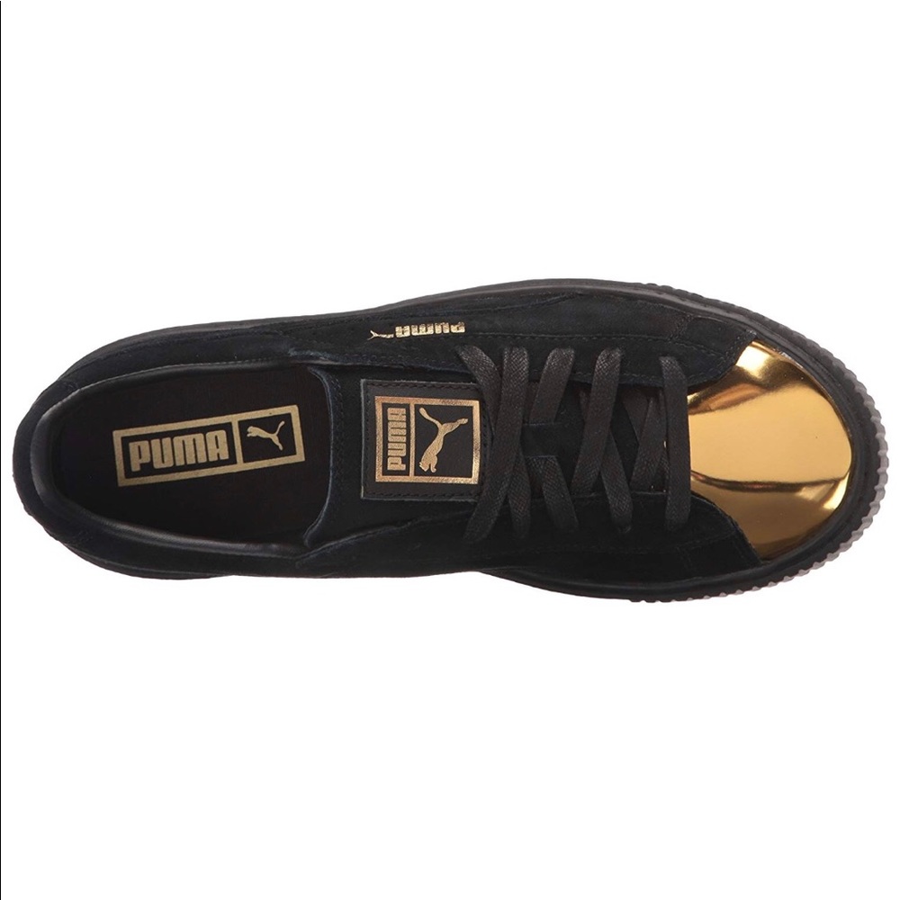 Black gold toe Puma sneakers